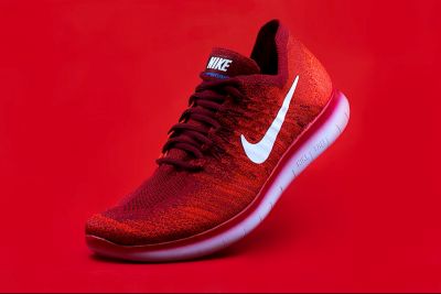 Trail running shoe, vibrant red and black